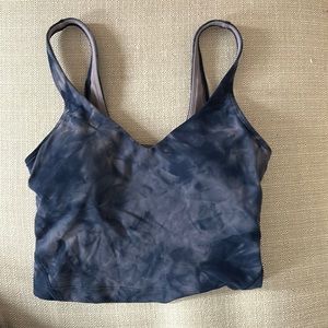 Lululemon sports bra, size 2. Never worn. Light purple and navy blue.